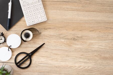 top view office stationery on wooden table with copy space.student stuff on desk.education concept