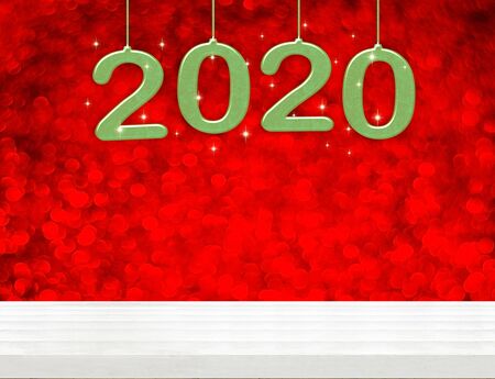 2020 happy new year green wood number (3d rendering) on white wood table with sparkling red bokeh wall,leave space for display or montage of design or content of christmas or new year eveの写真素材