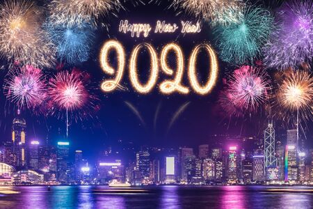 Happy new year 2020 firework over cityscape building near sea at night time celebration,mock up Banner for advertise on social mediaの写真素材