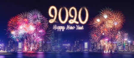 Happy new year 2020 firework over cityscape building near sea at night time celebration,mock up...
