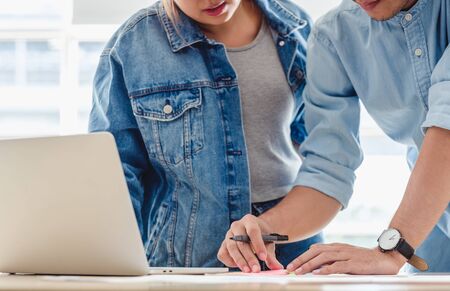 close up creative designer team brainstorming  in casual meeting on desk with laptop in meeting room at modern office with data sheet on table.business lifestyle conceptの写真素材