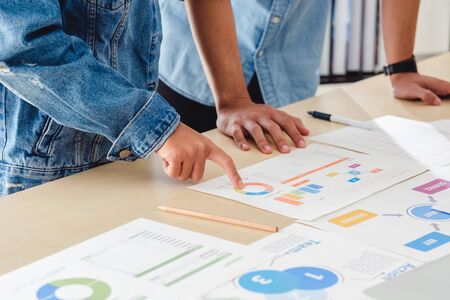 close up creative designer team brainstorming  in casual meeting on desk with laptop in meeting room at modern office with data sheet on table.business lifestyle concept.の写真素材