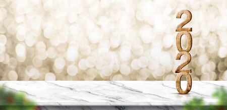 happy New year 2020 wood number (3d rendering) on marble table at blur abstract gold bokeh background, panoramic mock up banner space for product display,holiday celebration greeting cardの写真素材
