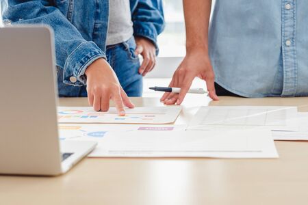 creative designer team brainstorming  in casual meeting on desk with laptop in meeting room at modern office with data sheet on table.business lifestyle conceptの写真素材