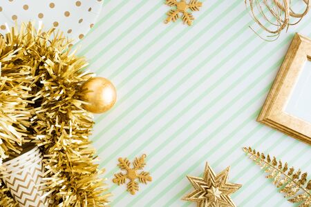 Merry christmas and happy new year background.top view of sparkling gold tinsel,ball,ornament...