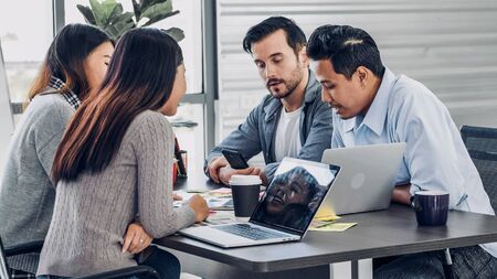 diversity creative designer team group discussion in office meeting room about solution of project.office lifestyleの写真素材