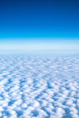 Blue sky and Cloud Top view from airplane window,Nature background.の写真素材
