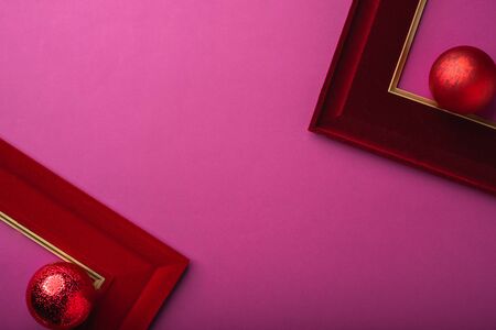Merry Christmas and happy new year purple background. top view of ball, picture frame decorate on...