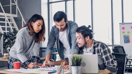 Creative designe team brainstrom branding project with designer team at meeting table with desktop computer.discussion idea in creative officeの写真素材