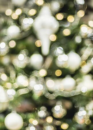Abstract color blur decoration ball and light string on christmas tree with bokeh light background.winter holiday seasonalの写真素材