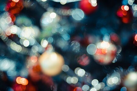 Abstract color blur decoration ball and light string on christmas tree with bokeh light background.winter holiday seasonalの写真素材