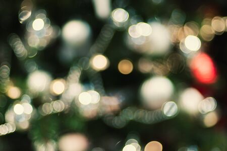 Abstract color blur decoration ball and light string on christmas tree with bokeh light background.winter holiday seasonalの写真素材
