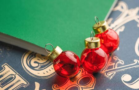 Christmas red ball decoration with green notebook on old type pattern background.holiday greeting cardの写真素材