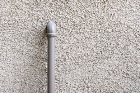pipe on grunge concrete texture wall background.weathered backdropの写真素材