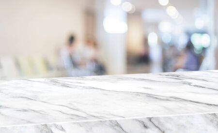 Healthty background.Empty diagonal white marble table with blur patient in hospital for treat virus...