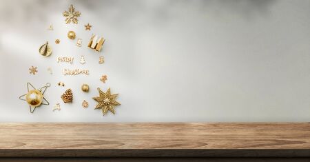 christmas object decoration into xmas tree shape on wall with sunlight shadow on wall over wood table at home.banner mockup space for display of product to advertising on media.new year backdropの写真素材