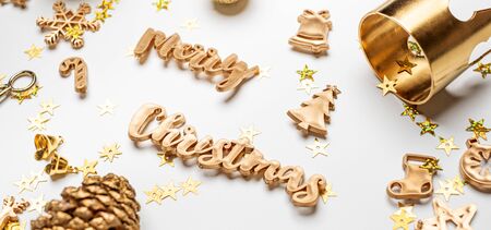 merry Christmas gold  shiny text with luxury xmas decoration items on white table.happy new year holiday conceptの写真素材