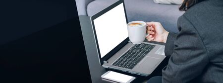 mockup laptop screen with businesswoman holding coffee cup,Digital Business disruption or marketing trending.digital transformation.banner background leave space for display designの写真素材