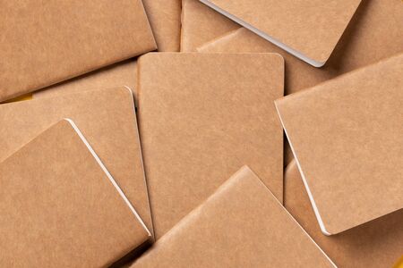 kraft brown notebook background texture.disorder alignment backdrop of book.content marketing conceptの写真素材