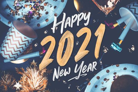 2021 happy new year hand brush storke font on marble table with party cup,party blower,tinsel,confetti.Fun Celebrate holiday party time table topの写真素材