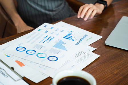 close up asian barista business owner show business plan to financial advisor about loan contract for open new restaurant business.small business entrepreneurの写真素材