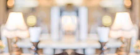 Blurred background dining table at cafe restaurant blur background with bokeh light.leisure lifestyleの写真素材