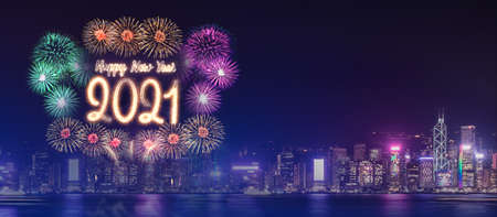 Happy new year 2021 firework over cityscape building near sea at night time celebration,mock up Banner for advertise on social mediaの写真素材