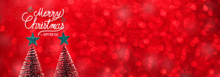 Merry christmas and happy new year text over xmas tree and green start on red glitter sparkling lights festive background.banner mockup for display of content for online advertiseの写真素材