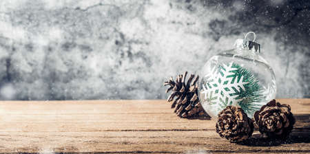 Christmas background with Christmas tree  bauble and pine cone on wood table with concrete wall for celebrate holiday greeting card backgroundの写真素材