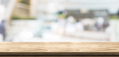 Empty wood table in coffee shop background bokeh light .Mock up for display of product,Banner for advertise on online media,business presentationの写真素材
