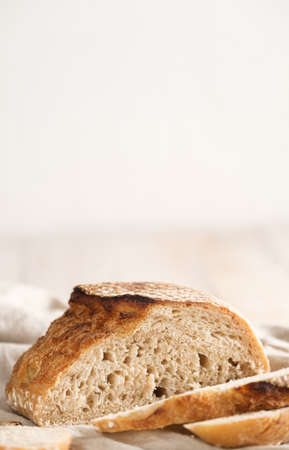 Sour dough bread cut on wood table.healthy foodの写真素材