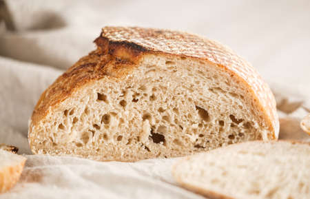 Sour dough bread cut on wood table.healthy foodの写真素材