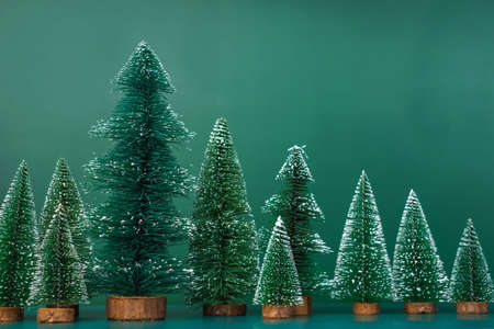 christmas tree group on green background.の写真素材