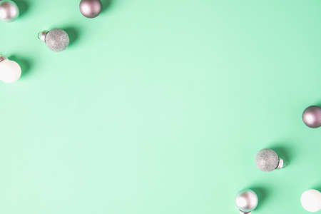 group of christmas bauble ball decoration on pastel green backgroundの写真素材