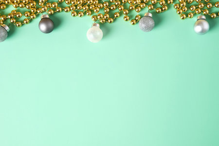 group of christmas bauble ball decoration on pastel green backgroundの写真素材