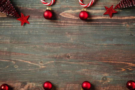 Christmas ball, candy cane pine tree decoration ornament on table wood backgroundの写真素材