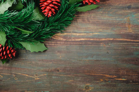 Christmas pine tree fir with pine cone decoration on vintage rustic wood table backgroundの写真素材