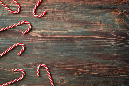 group of candy cane on rustic table top view backgroundの写真素材