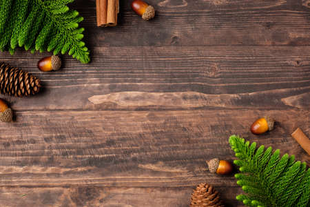 Christmas pine tree and pine cone on woooden table backgroundの写真素材