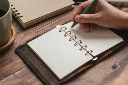 open blank planner on wooden working deskの写真素材