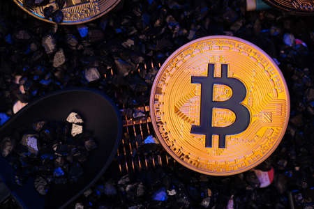 Mining Bitcoin crypto currency on circuit  board.virtural money.blockchain technology.mining conceptの写真素材