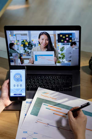 developer asisn woman video conference ux ui design meeting  online with laptop at homeの写真素材