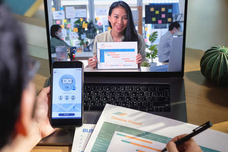 developer asisn woman video conference ux ui design meeting  online with laptop at homeの写真素材
