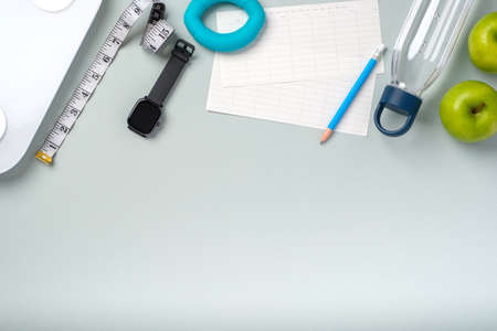 top view exercise stuff on green purple table for healty lifestyleの写真素材