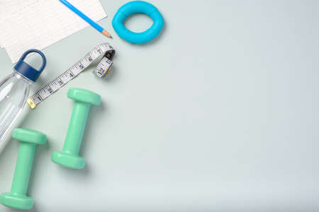 top view exercise stuff on green purple table for healty lifestyleの写真素材