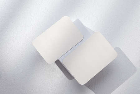 mockup blank busienss card on white block with sunlightの写真素材