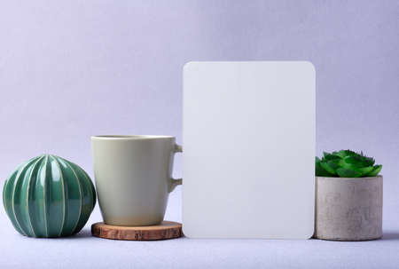 blank paper posert wih cactus on pastel violet backgroundの写真素材