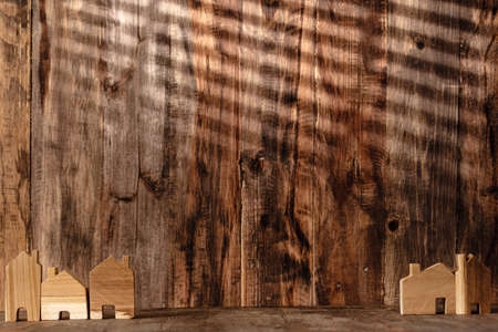 set of wooden house decoration on wood table and wood wall backgroundの写真素材