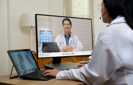 Asian woman doctor video conference discussion with doctor team about diagnosis patient symptom