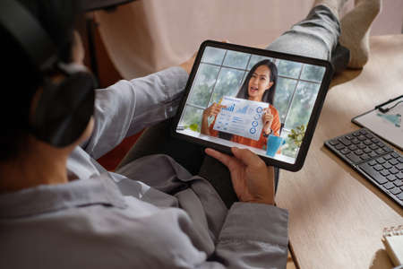 asian woman video conference online at home with relax poseの写真素材